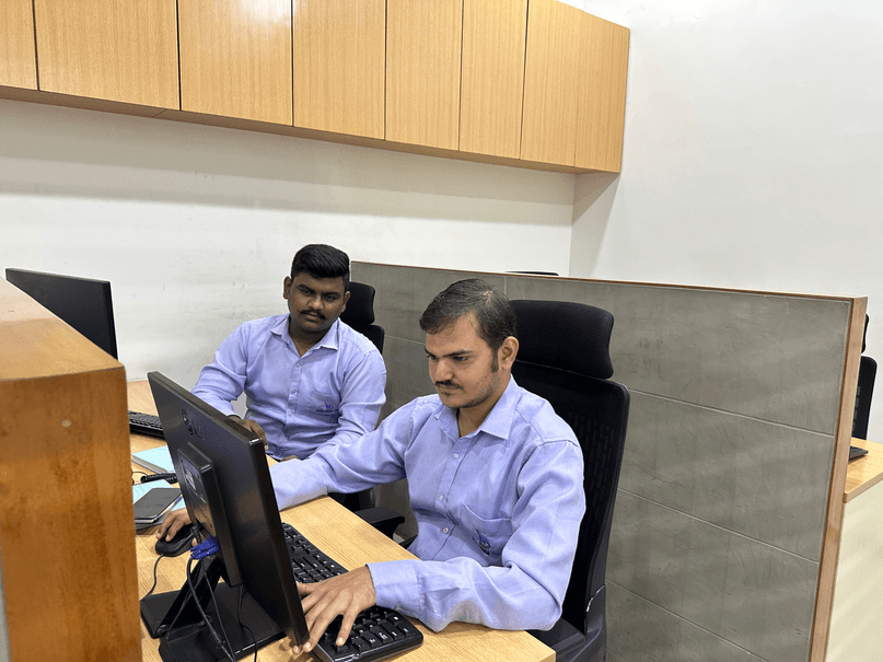 Dhruvisha HVAC employees collaborating at work